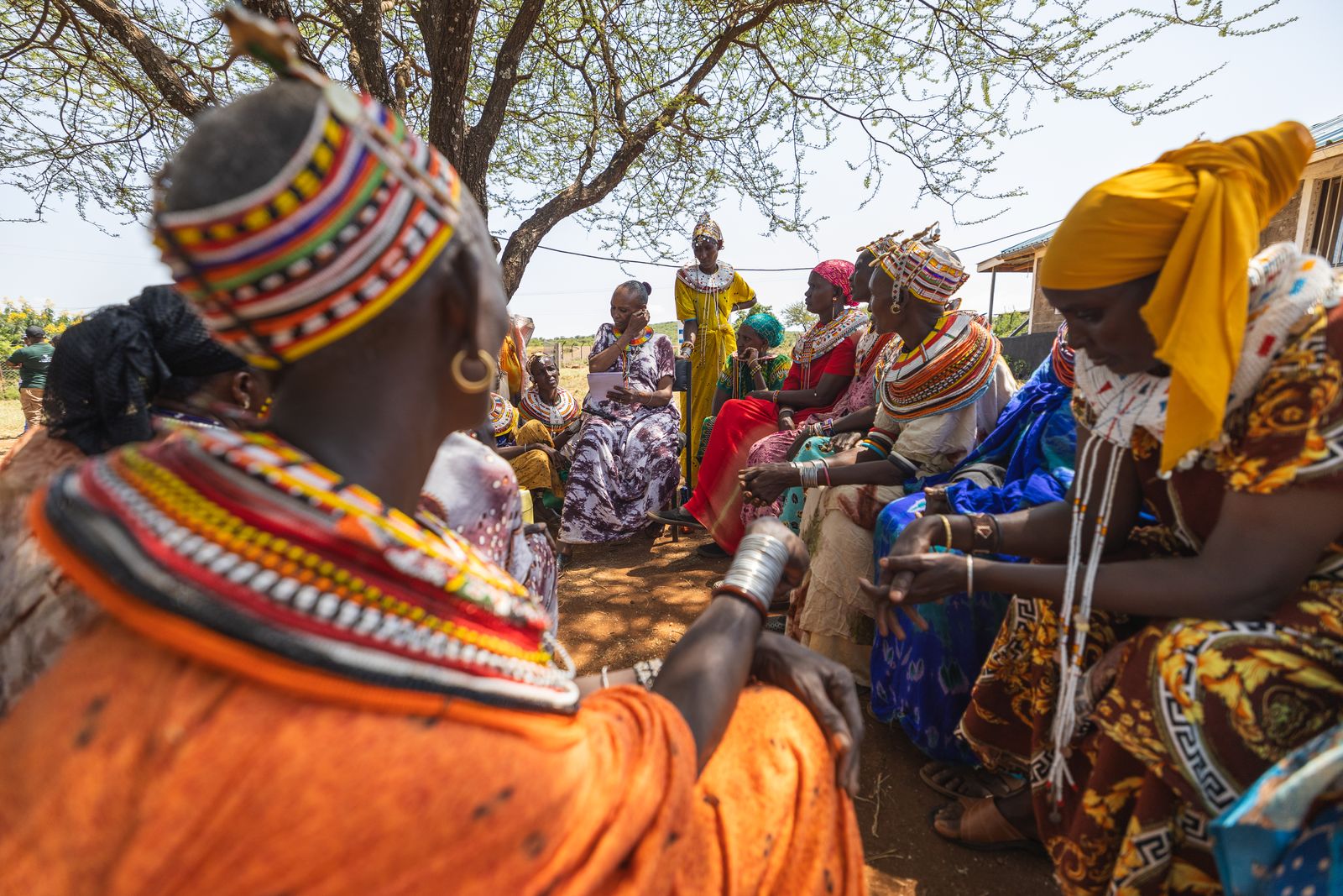 A community meeting in the field.